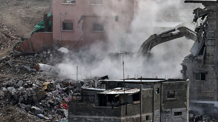 Israeli military excavators are tearing down residential buildings in the Nur Shams camp for Palestinian refugees 