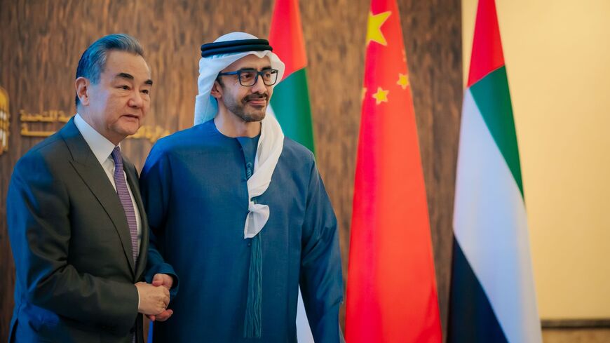Chinese Foreign Minister Wang Yi (L) and Emirati Foreign Minister Sheikh Abdullah bin Zayed Al Nahyan (R) during a meeting on Dec. 12 in Abu Dhabi.