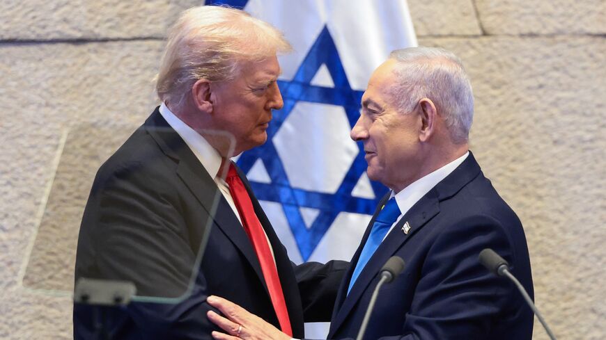 US President Donald Trump speaks with Israeli Prime Minister Benjamin Netanyahu at the Knesset, Israel's parliament, on Oct. 13, 2025, in Jerusalem. 