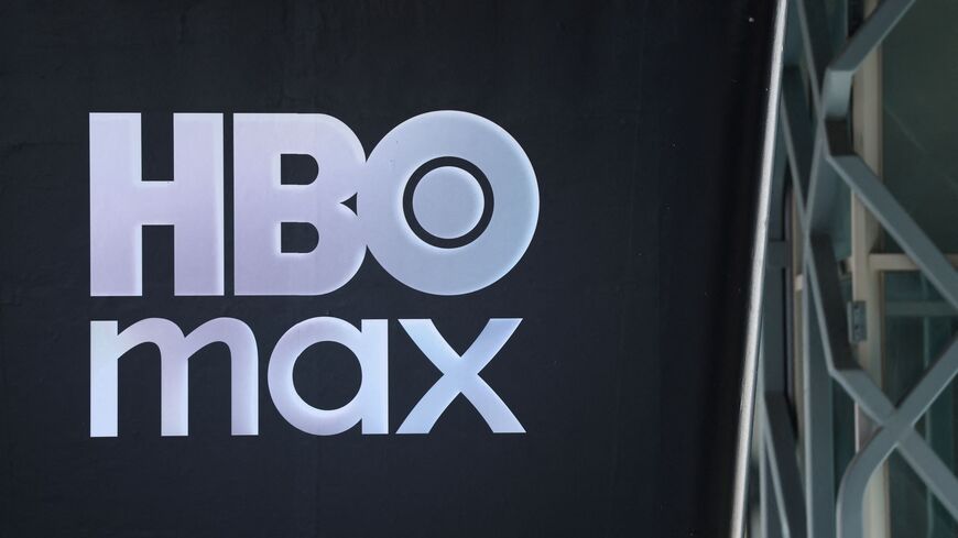 The HBO Max logo is seen outside the Warner Bros. Discovery offices in Culver City, California, on December 5, 2025. Streaming giant Netflix said December 5, 2025 it will buy film and television studio Warner Bros. Discovery for nearly $83 billion, the entertainment industry's biggest consolidation deal this decade. The acquisition gives Netflix access to a vast film catalog as well as the prestigious streaming service HBO Max. (Photo by Patrick T. Fallon / AFP via Getty Images)