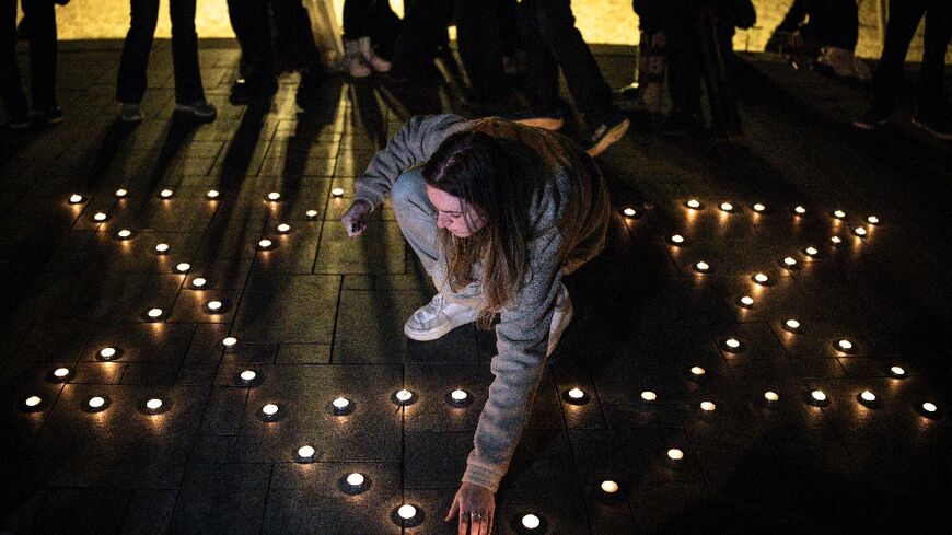 Hours after the shooting in Bondi Beach, a candlelight vigil was held on a beach in Tel Aviv where mourners lit candles