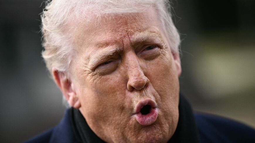 US President Donald Trump speaks to the press before boarding Marine One as he departs from the South Lawn of the White House in Washington