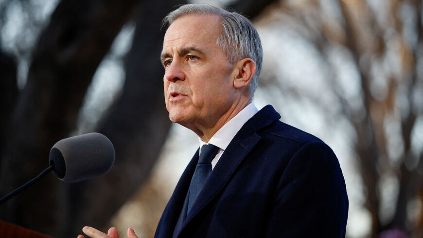 Canada's Prime Minister Mark Carney speaks to the media at Ritan Park, during the first visit by a Canadian prime minister to China since 2017, in Beijing, China, January 16, 2026. REUTERS/Carlos Osorio