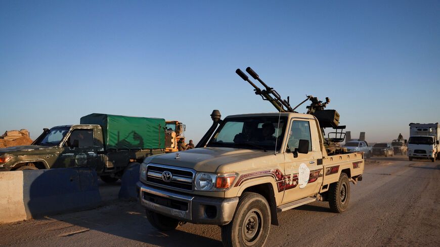 Members of the Syrian army ride a vehicle en route to Al-Hasakah, following the withdrawal of the Syrian Democratic Forces, Syria, January 20, 2026. REUTERS/Khalil Ashawi