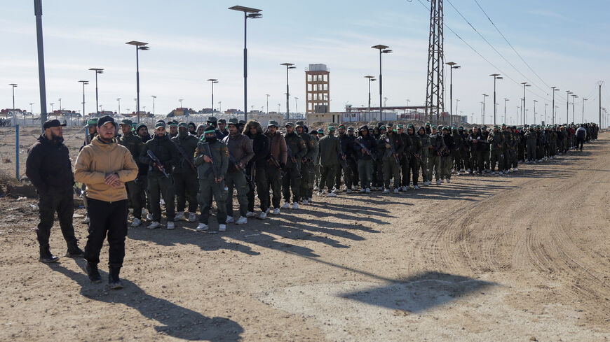 Members of the Syrian government security forces gather after they took control of al-Hol camp following the withdrawal of Syrian Democratic Forces (SDF), in Hasaka, Syria, January 21, 2026. REUTERS/Khalil Ashawi
