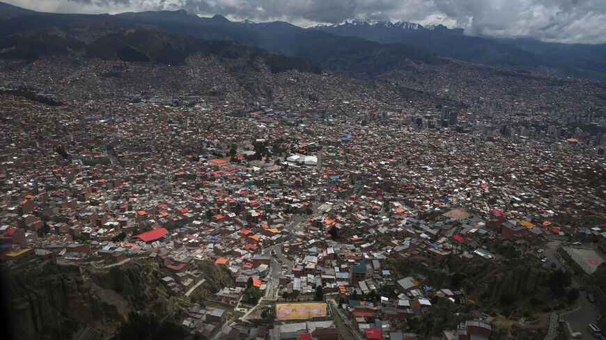 A view, taken through a window, shows the city of La Paz as the government discusses stabilizing the energy sector amid declining production and economic pressures, in El Alto, Bolivia, January 15, 2026. REUTERS/Claudia Morales/File Photo