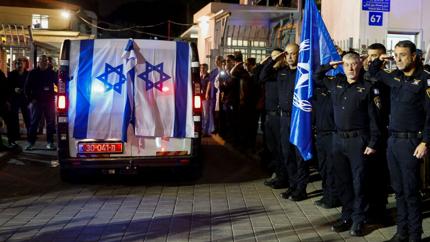 Police officers salute as the vehicle carrying the body of Israeli police officer, and the last hostage Ran Gvili, kidnapped in the October 7, 2023, Hamas attack, arrives to the Institute of Forensic Medicine after being found and identified in the Gaza Strip, according to the statement by the Israeli military, in Tel Aviv, Israel, January 26, 2026. REUTERS/Amir Cohen