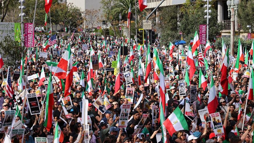 Protesters held flags and placards during a rally in solidarity with protesters in Iran in Los Angeles 