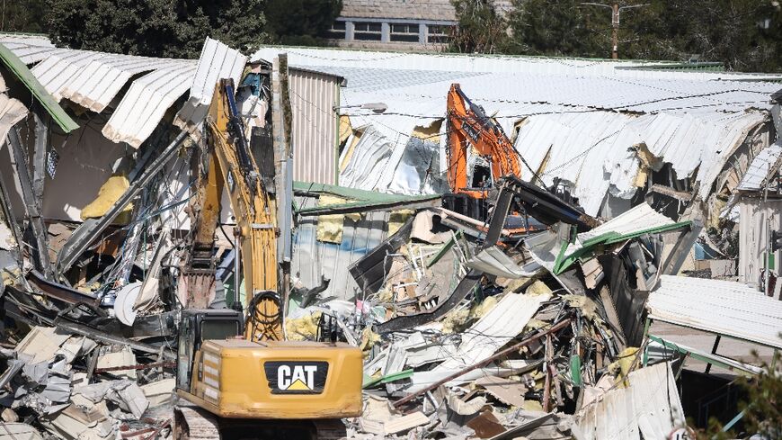 AFP photos showed heavy machinery demolishing at least one structure at the compound