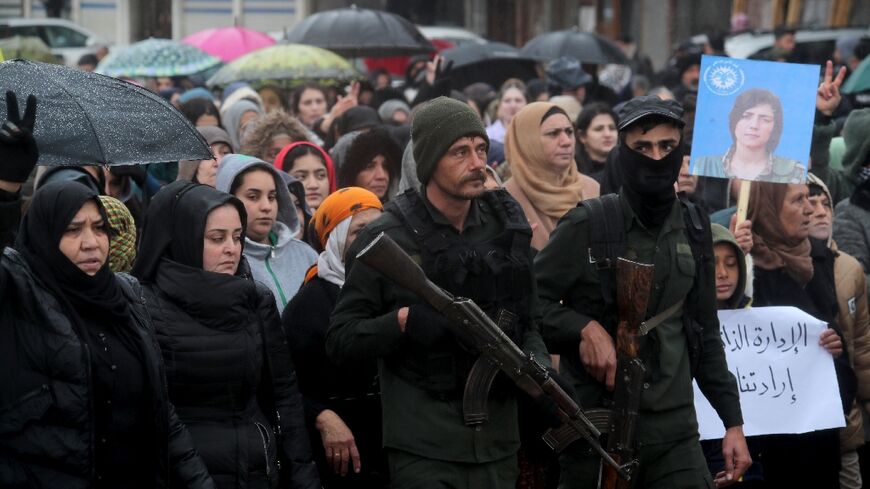 Kurds rallied in Qamishli against a Syrian government advance before the announcement of a truce deal that many now see as a betrayal of their aspirations
