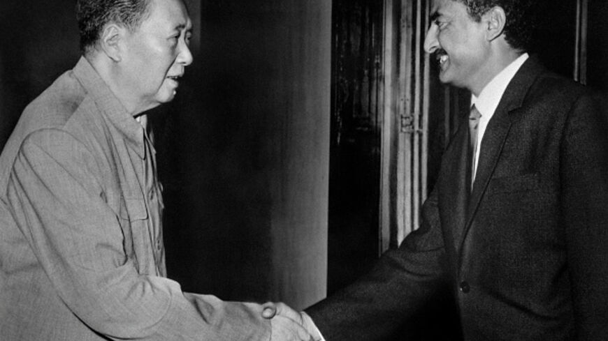 Republic People of China's President Mao Zedong shakes hands with People's Democratic Republic of Yemen Salim Rubai Ali, in August 1970, in Pekin, as Ali leads a South Yemen's delegation in China. During the visit, China announced it would provide an additional $43 million loan to South Yemen, earmarked for new projects, including the construction of a textile factory outside Aden and a road of 315 kilometers leading to Mukalla. (Photo by XINHUA / AFP) / China OUT (Photo by -/XINHUA/AFP via Getty Images)