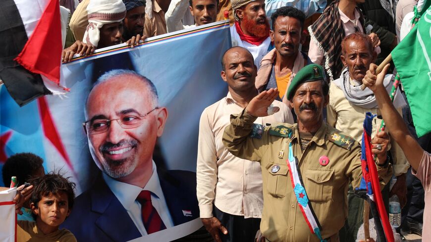 Yemeni members of the Sabahiha tribes of Lahj, who live along the strip between the south and north of the country and who support the UAE-backed Southern Transitional Council (STC), hold an image of the STC leader Aidaros Alzubidi. 