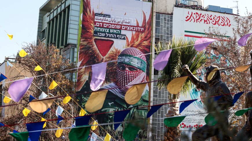 A large anti-Israeli banner portraying an image of a Palestinian fighter and the slogan in Persian and Hebrew, "Endless Voice of Resistance" is erected in Palestine Square in Tehran on Dec. 31, 2025. 