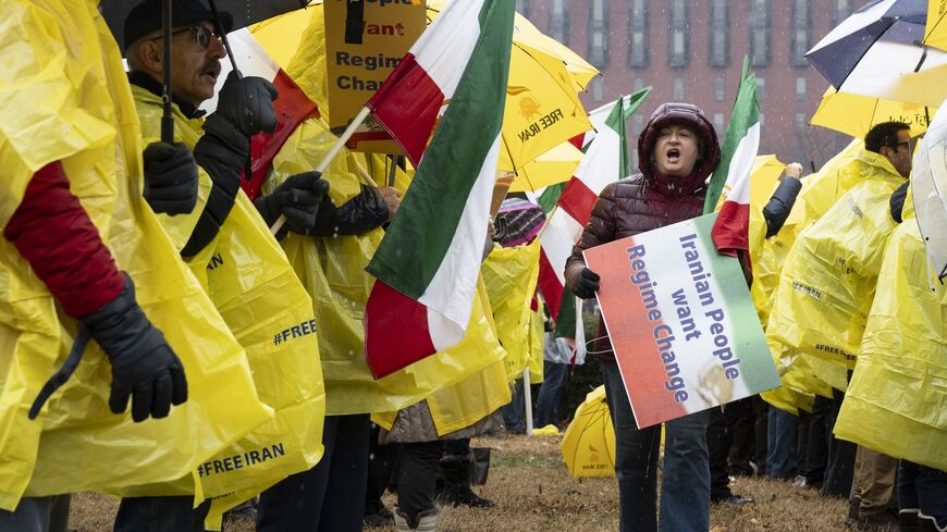 Sadaf Ebrahimi walks down a row of demonstrators at Lafayette Park in front of the White House during the "Free Iran" rally on Jan 10, 2026, in Washington. 