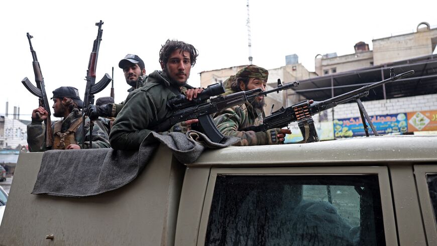 Syrian government troops patrol the streets of Tabqa, in Raqqa province, on the southwestern banks of the Euphrates, Jan. 18, 2026.
