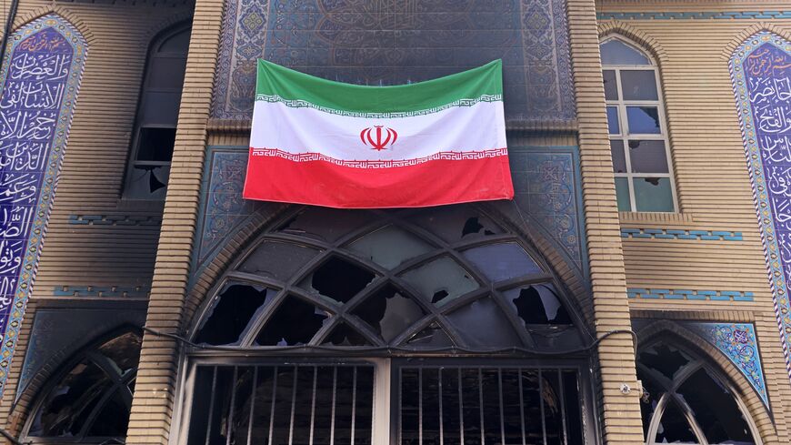 This photograph shows an Iranian national flag installed on the Beheshti Mosque that was damaged during recent public protests, in Tehran on Jan. 21, 2026. 
