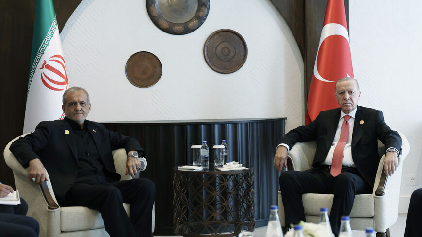 Turkish President Recep Tayyip Erdogan meets with Iranian President Masoud Pezeshkian as they attend the 17th Summit of the Economic Cooperation Organization in Khankendi, Azerbaijan on July 4, 2025.