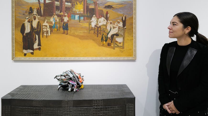 Safeya Binzagr's painting of a coffee shop on Madina Road (top) and John Chamberlain sculpture Spledidium (below) on view as part of Sotheby's Origins II in Diriyah, Riyadh. (Courtesy of Sotheby’s)