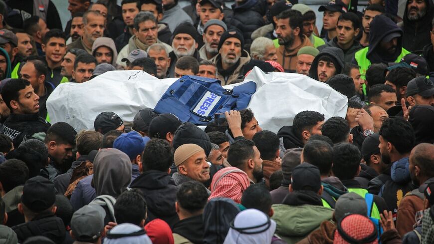 Hundreds crowded into the grounds of Nasser Hospital in Khan Yunis in Gaza to pay tribute to three fallen colleagues