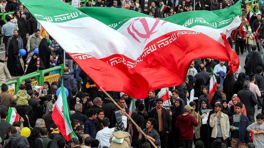 In a first, women without hijab were seen at the rally