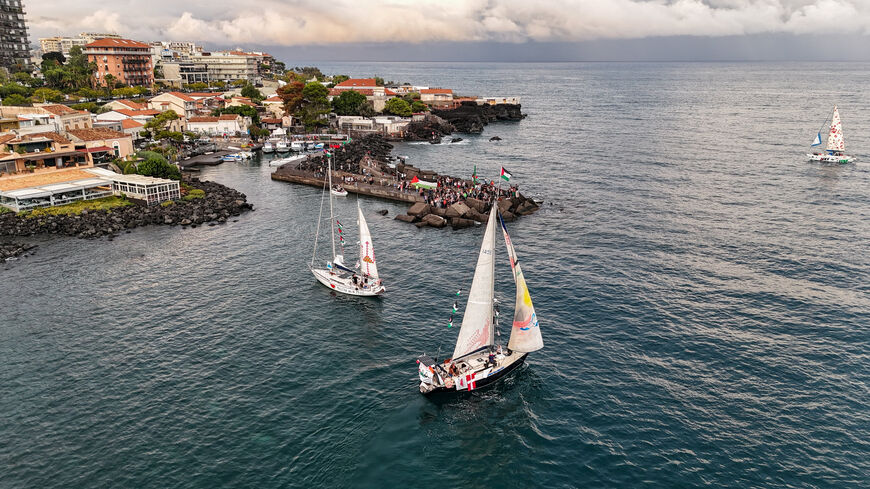 A drone picture shows a flotilla of humanitarian boats led by French activist Melissa, dubbed the “Thousand Madleens,” departing from the Sicilian port of San Giovanni li Cuti in Catania, Italy September 27, 2025. REUTERS/Danilo Arnone/File Photo