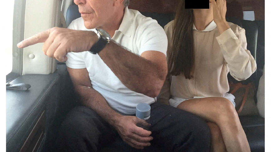 FILE PHOTO: Late financier and convicted sex offender Jeffrey Epstein appears with a woman, whose identity has been obscured, in this image from the Epstein estate released by House Oversight Committee Democrats in Washington, D.C., U.S., on December 18, 2025. House Oversight Committee Democrats/Handout via REUTERS/File Photo