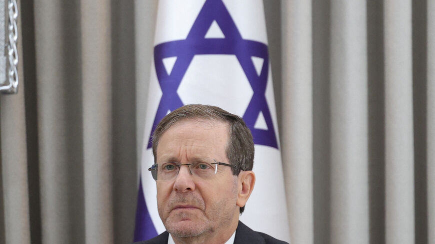 Israeli President Isaac Herzog looks on during a meeting with German Chancellor Friedrich Merz at the President's residence in Jerusalem, December 6, 2025.    Abir Sultan/Pool via REUTERS