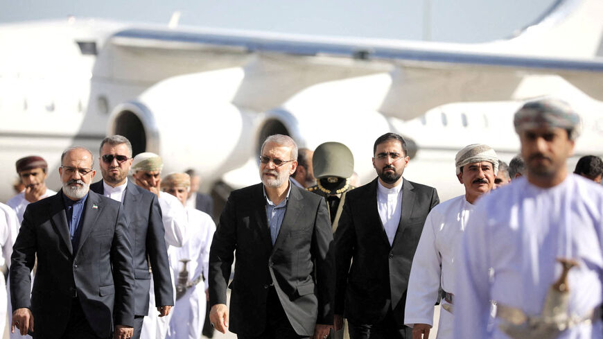 Secretary of the National Security Council, Ali Larijani is welcomed by the Minister of the Royal Office in the Sultanate of Oman, Sultan bin Mohammed al Numani, upon his arrival in Muscat, Oman, February 10, 2026. Iran's National Security Council/WANA (West Asia News Agency)/Handout via REUTERS