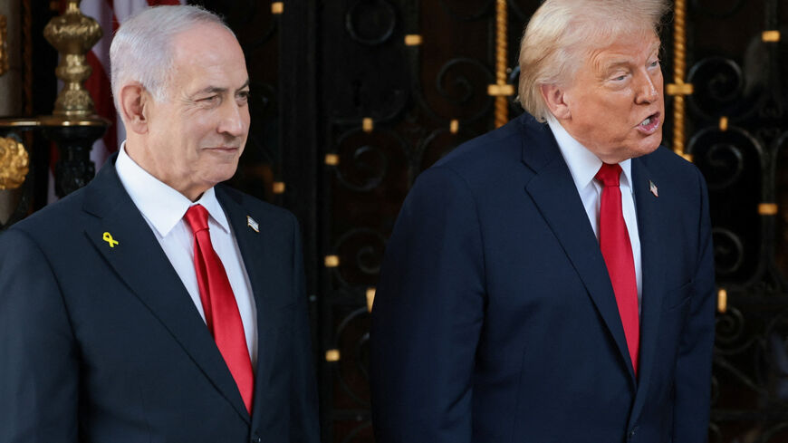 U.S. President Donald Trump speaks next to Israeli Prime Minister Benjamin Netanyahu upon arrival for meetings at Trump's Mar-a-Lago club in Palm Beach, Florida, U.S., December 29, 2025. REUTERS/Jonathan Ernst