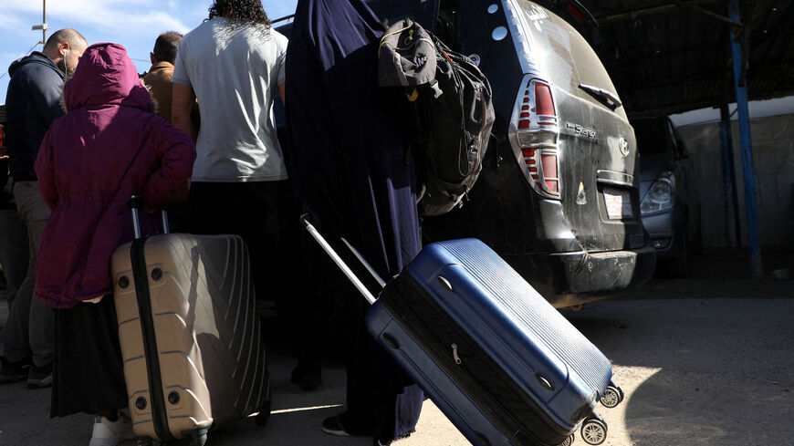 Members of Australian families believed to be linked to the Islamic State militants leave Roj camp near Derik, Syria February 16, 2026. The families later returned to the detention center due to "technical reasons," two sources told Reuters. REUTERS/Orhan Qereman