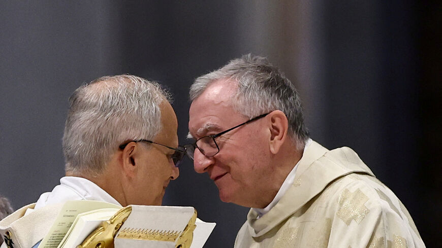 FILE PHOTO: Pope Leo XIV speaks with Vatican Secretary of State Cardinal Pietro Parolin during the Mass for the Holy See Jubilee, in St. Peter's Basilica, at the Vatican, June 9, 2025. REUTERS/Yara Nardi/File Photo