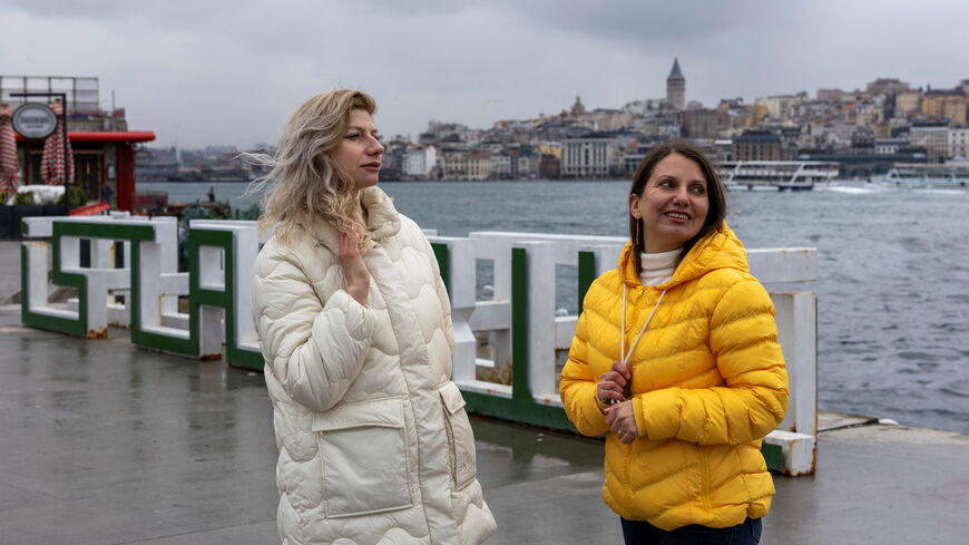 Iryna Kushnir and her high school friend Olga Yermolenko, Ukrainian women who fled Kharkiv after Russia launched a full-scale invasion, walk along the Bosphorus in Istanbul, Turkey, February 18, 2026. REUTERS/Umit Bektas