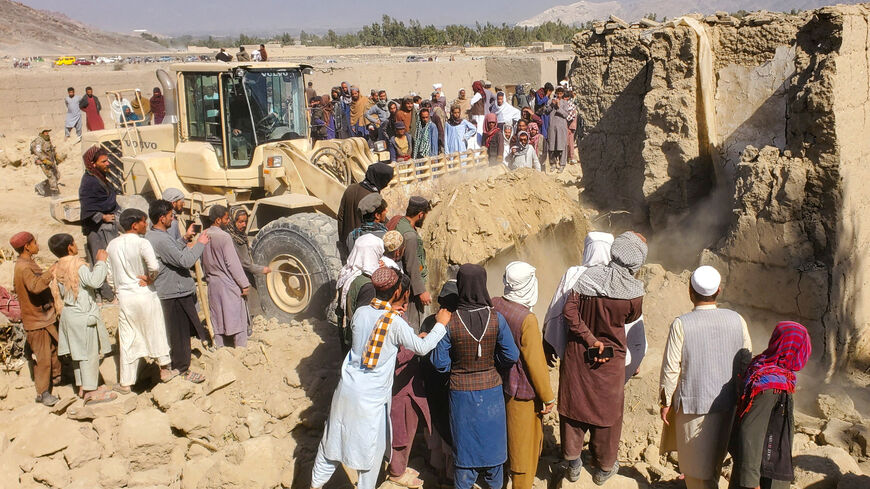 Residents gather at the site, following the Pakistani airstrikes, in Bihsud district, Nangarhar province, Afghanistan, February 22, 2026. REUTERS/Stringer