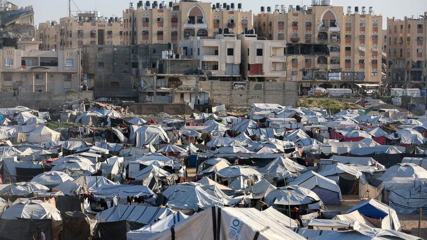 Palestinians displaced during the two-year Israeli offensive shelter at a tent camp in Khan Younis in the southern Gaza Strip, February 10, 2026. REUTERS/Ramadan Abed