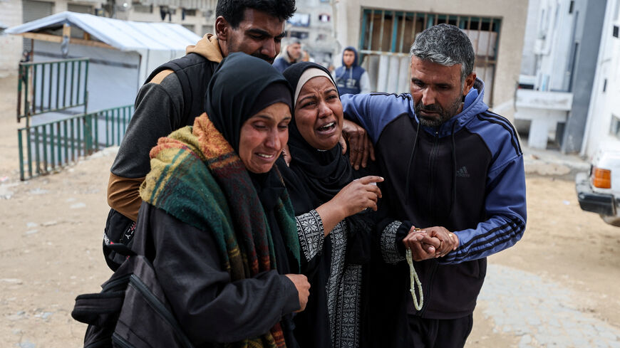 Mourners react during the funeral of two Palestinians killed by an Israeli strike on Thursday, according to medics, at Shifa hospital in Gaza City, February 26, 2026. REUTERS/Dawoud Abu Alkas