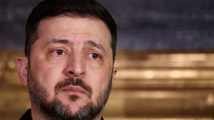 FILE PHOTO: Ukrainian President Volodymyr Zelenskiy looks on as he delivers a statement along with Bavarian federal state prime minister Markus Soeder (not pictured), chairman of the Munich Security Conference Wolfgang Ischinger (not pictured), Polish Prime Minister Donald Tusk (not pictured) during the Munich Security Conference MSC, at the Residenz of the former Bavarian Kings, in Munich, Germany, February 14, 2026. REUTERS/Liesa Johannssen/File Photo