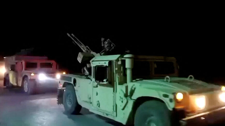 Military vehicles move on a road in a location given as Nangarhar, Afghanistan, in this screengrab from a handout video released on February 26, 2026. Pakistani and Afghan border forces clashed on Thursday night after the Taliban launched what it called retaliatory strikes on Pakistani installations, sharply escalating tensions after days of cross-border hostilities.   Afghanistan's Ministry of Defense/Handout via REUTERS