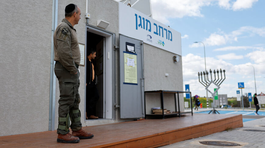 An Israeli security personnel stands by a protected area after missiles were launched towards Israel from Iran following strikes by Israel and the U.S. on Iran, in Latrun, Israel, February 28, 2026. REUTERS/Amir Cohen