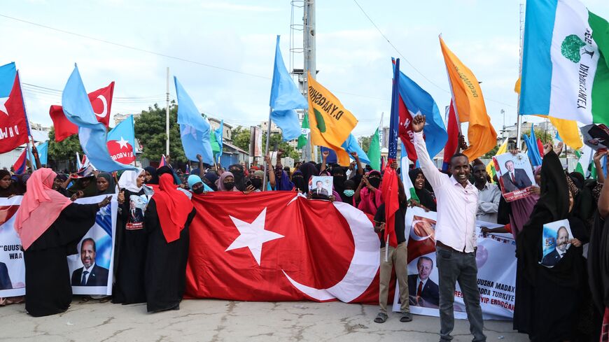 Somalis celebrate the victory of Turkish President Recep Tayyip Erdogan after he won the presidential run-off election during the celebration organised by the government in Mogadishu, on May 29, 2023. (Photo by Hassan Ali Elmi / AFP) (Photo by HASSAN ALI ELMI/AFP via Getty Images)