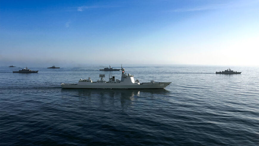 This handout photo made available by the Iranian Army Office on March 11, 2025 shows the Chinese People's Liberation Army Navy guided-missile destroyer Baotou (133) during joint military drills between Iran, Russia, and China in the Gulf of Oman.