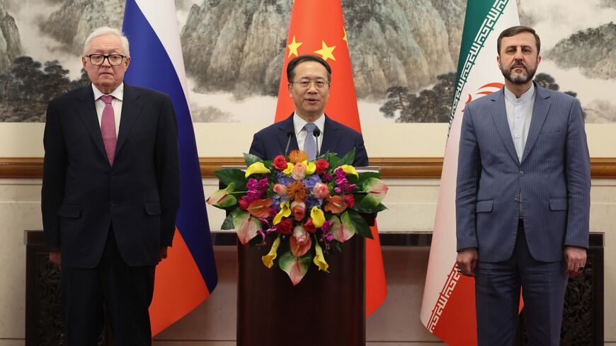 (L-R) Russian Deputy Foreign Minister Sergei Ryabkov, Chinese Executive Vice Minister of Foreign Affairs Ma Zhaoxu, and Iranian Deputy Foreign Minister Kazem Gharibabadi hold a press conference after their meeting in Beijing on March 14, 2025.
