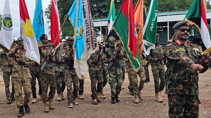 Sudanese army soldiers parade in the streets of eastern Sudan's city of Gedaref on Aug. 14, 2025, to mark the 71st anniversary of the formation of the Sudanese army. 