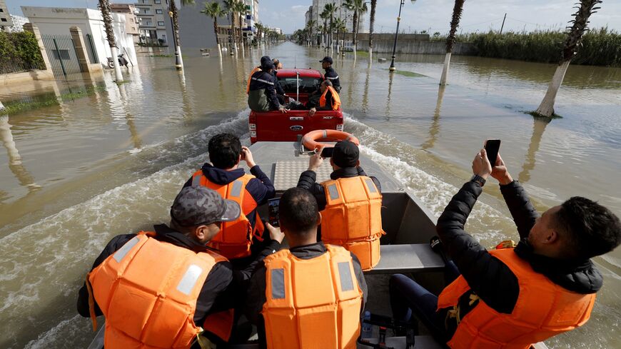 An emergency vehicle drives through flood waters as residents are evacuated and relocated to other towns as preventive and emergency evacuations are carried out to move residents living near flood-prone areas following the weather alert and the rise in the water level of the Loukkos River, with flooding expected in the coming days, in Ksar El Kebir on Feb. 1, 2026. 