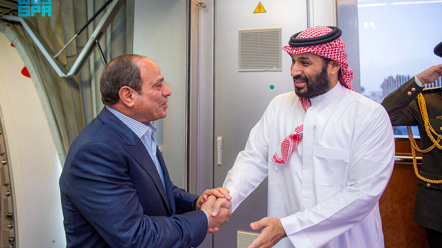 This handout picture released by the Saudi Press Agency (SPA) on February 23, 2026, shows Saudi Crown Prince Mohammed bin Salman (R) welcoming Egypt's President Abdel Fattah El-Sisi (L) upon his arrival for an official visit at King Abdulaziz International Airport in Jeddah. (Photo by Ahmed NURELDINE / SPA / AFP via Getty Images)