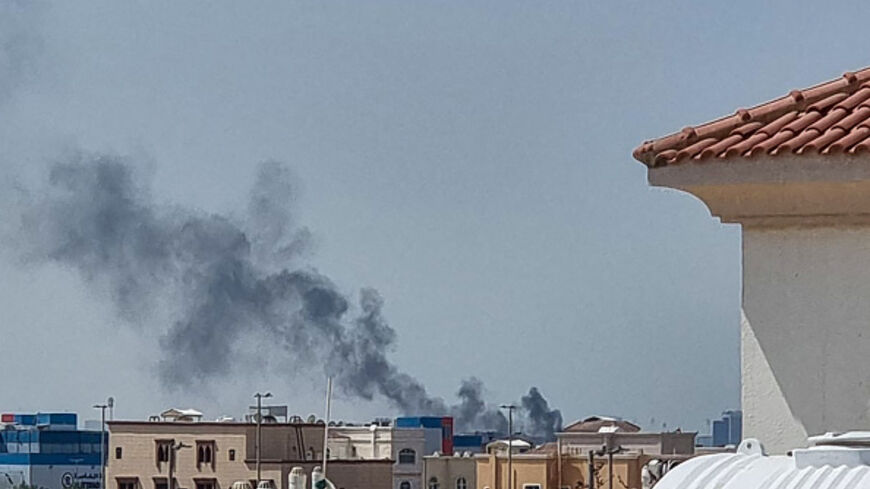 A smoke plume rises over Abu Dhabi from the site of an Iranian missile strike on February 28, 2026. Iranian missiles hit capital cities around the wealthy Gulf on February 28, killing at least one, in retaliation for a US and Israeli attack that threatened to spark a wider conflict. One civilian died in Abu Dhabi, capital of the United Arab Emirates, after being struck by falling debris, according to the ministry of defence. (Photo by AFP via Getty Images)