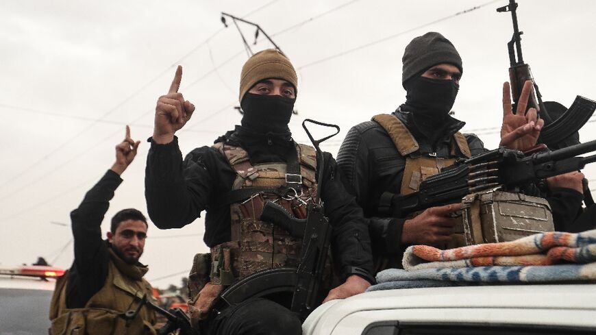 Syrian government internal security forces enter the northeastern Syrian city of Hasakeh