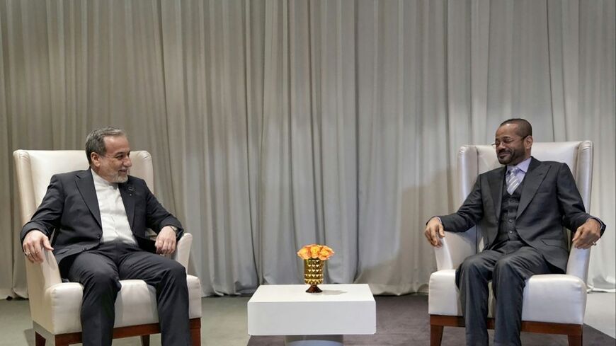 Iranian Foreign Minister Abbas Araghchi (L) meets with his Omani counterpart Badr Albusaidi in Geneva ahead of fresh negotiations with the US