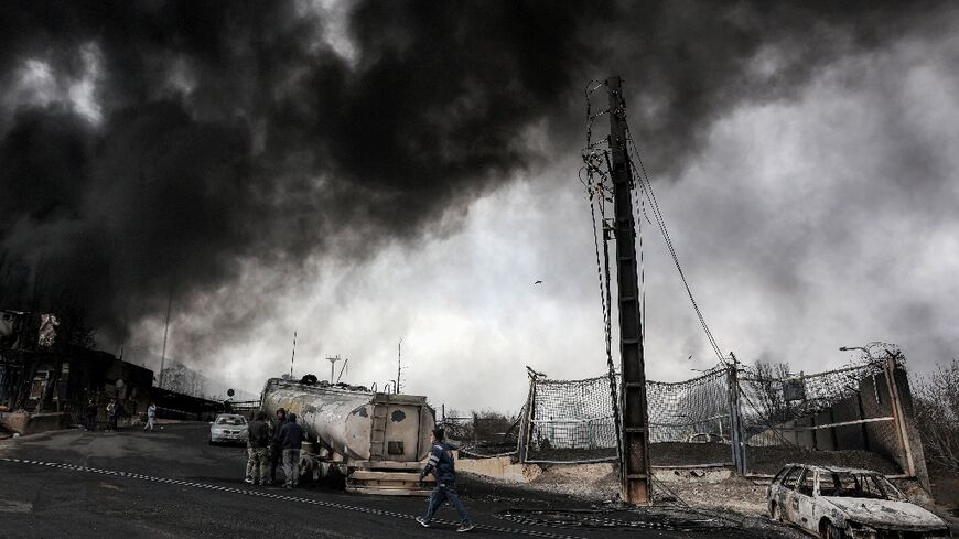 Tehran woke up to dark smoke clouds blotting out the skies after Israeli warplanes targeted oil plants around the city