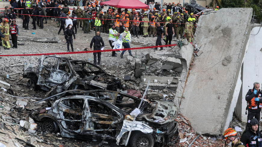 Emergency personnel work at the site of an Iranian strike in Beit Shemesh, Israel, March 1. REUTERS/Ammar Awad