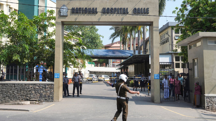 Security personnel stand guard in front of the National Hospital Galle where injured people are receiving treatment following a submarine attack on an Iranian ship off Sri Lanka, in Galle, Sri Lanka, March 4, 2026. REUTERS/Thilina Kaluthotage